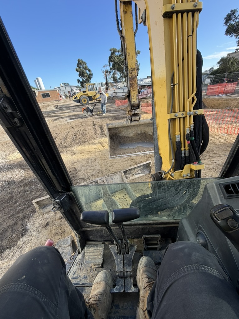 Excavator preparing a construction site